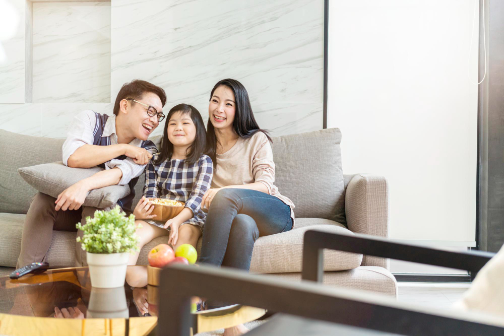 asian-happiness-family-talking-relaxing-sofa-watch-tv-together